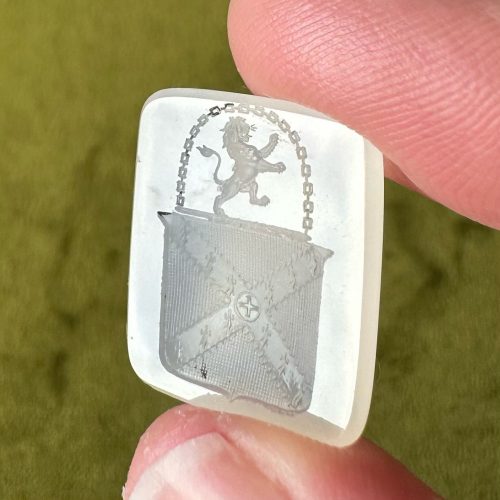 Georgian chalcedony intaglio with imagery of a lion rampant, beneath an arced chain, on top of a shield