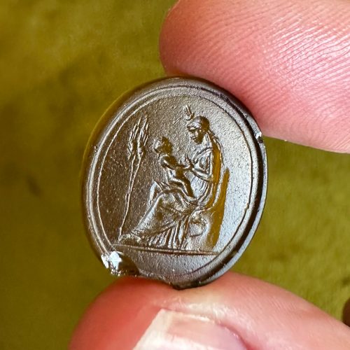 Dark yellow paste intaglio with Venus in classical robes, and Cupid on her lap