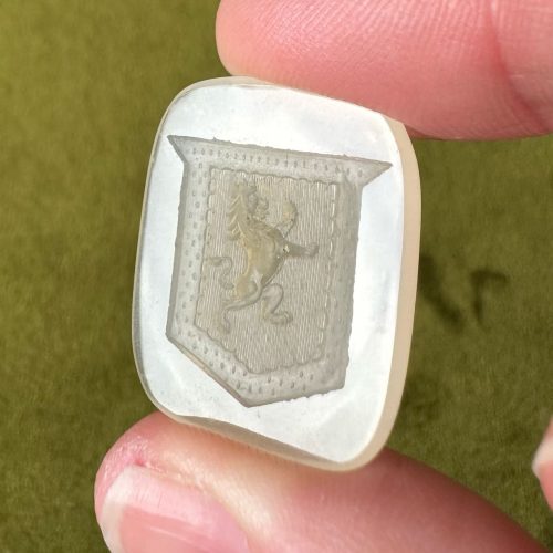 Creamy chalcedony intaglio with image of a lion rampant within an angular shield