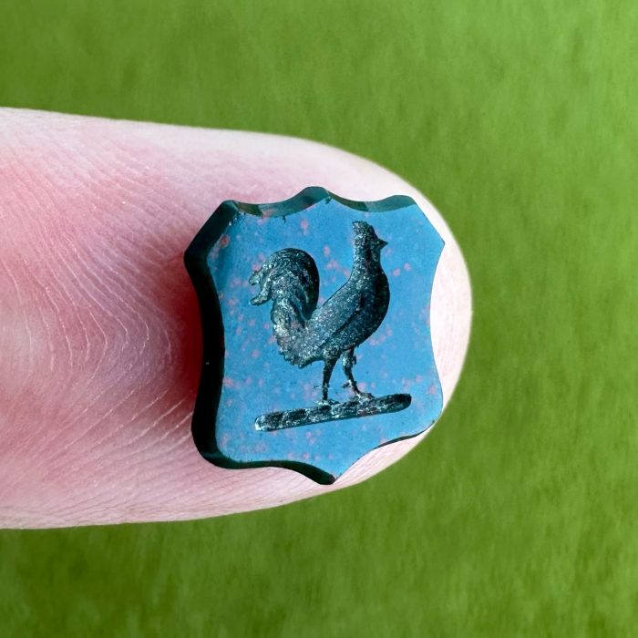 Shield shaped bloodstone intaglio with imagery of a cockerel