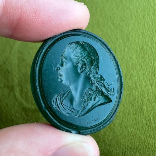 Large paste intaglio with incredibly detailed portrait of a woman in profile, signed Logan