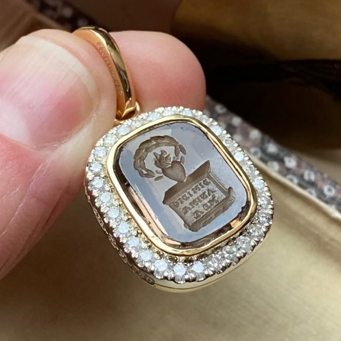 Gold intaglio seal pendant with diamond bezel