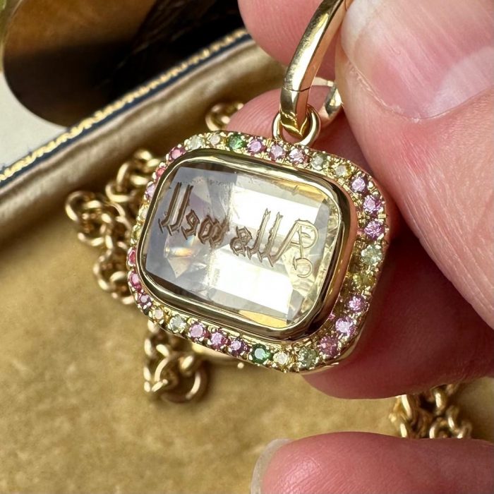 Gold intaglio seal pendant with pastel diamond bezel