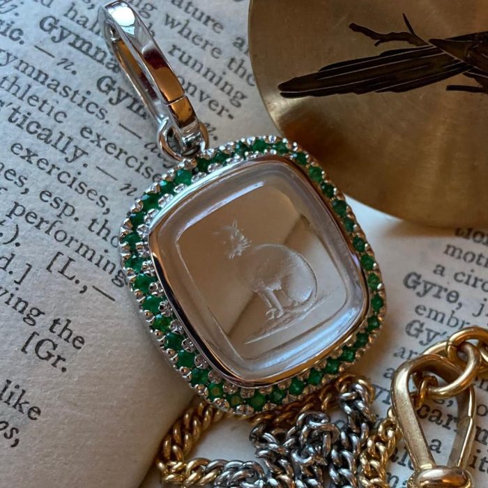 Platinum set intaglio seal pendant with an emerald and diamond bezel