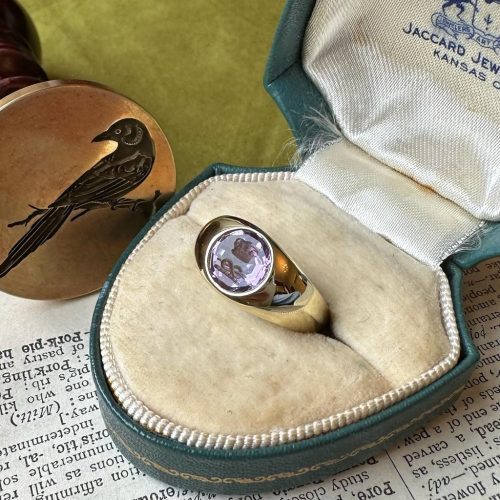 Close up of rubover intaglio seal ring in box